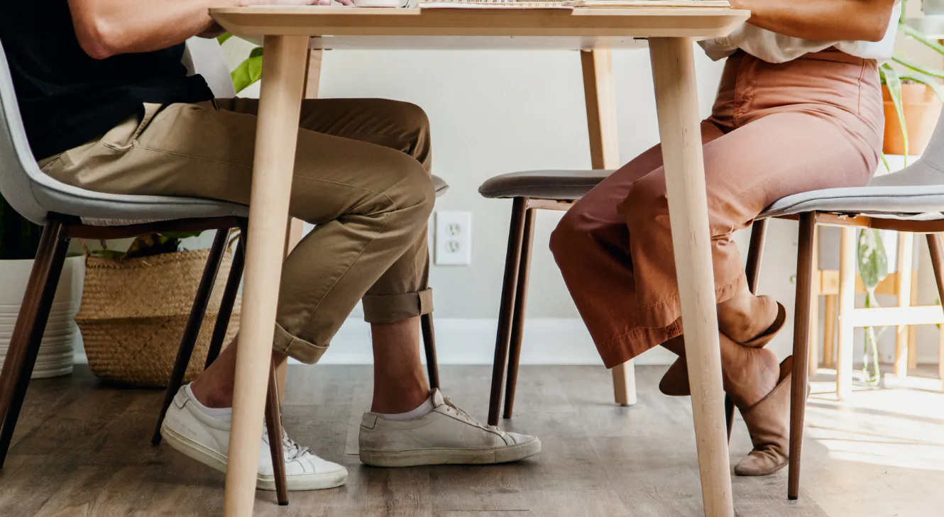 A man and a woman sitting at a table.