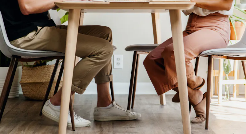 A man and a woman sitting at a table.
