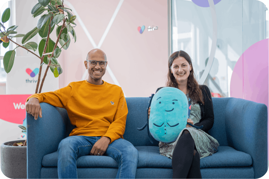 Thriva doctors sitting on blue sofa