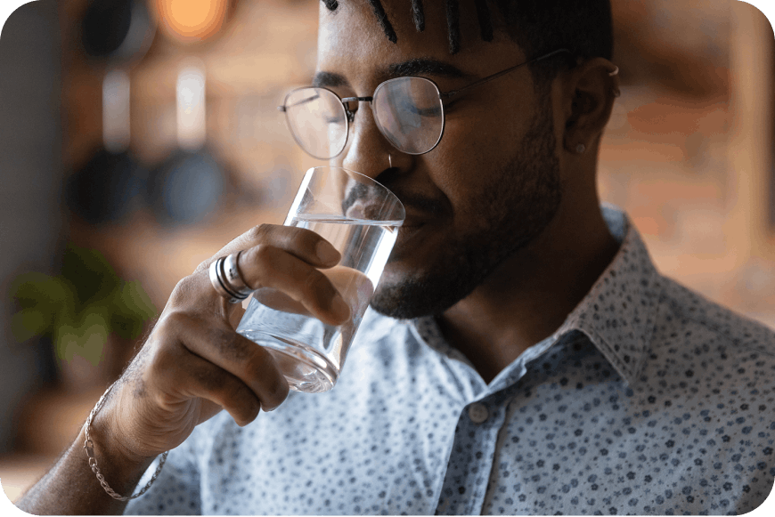 Man drinking a glass of water