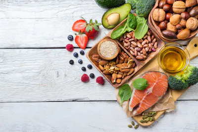 Foods that lower your cholesterol — oily fish, fruits, nuts, and avocados.