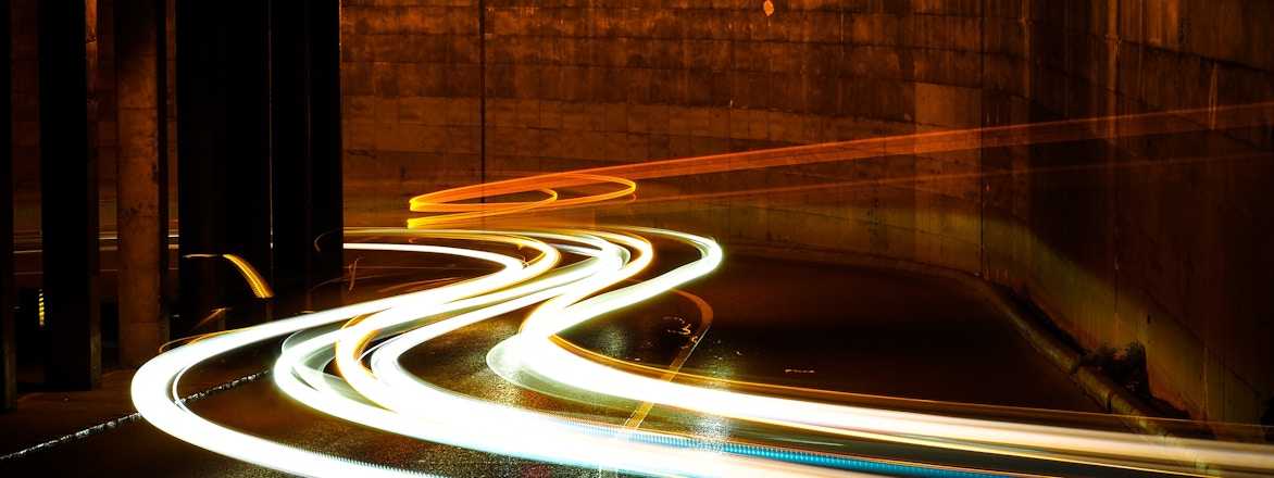 photographic long exposure of cars traveling thru a tunnel. Titled - Lights in the night. By Marc Sendra Martorell - https://unsplash.com/@marcsm