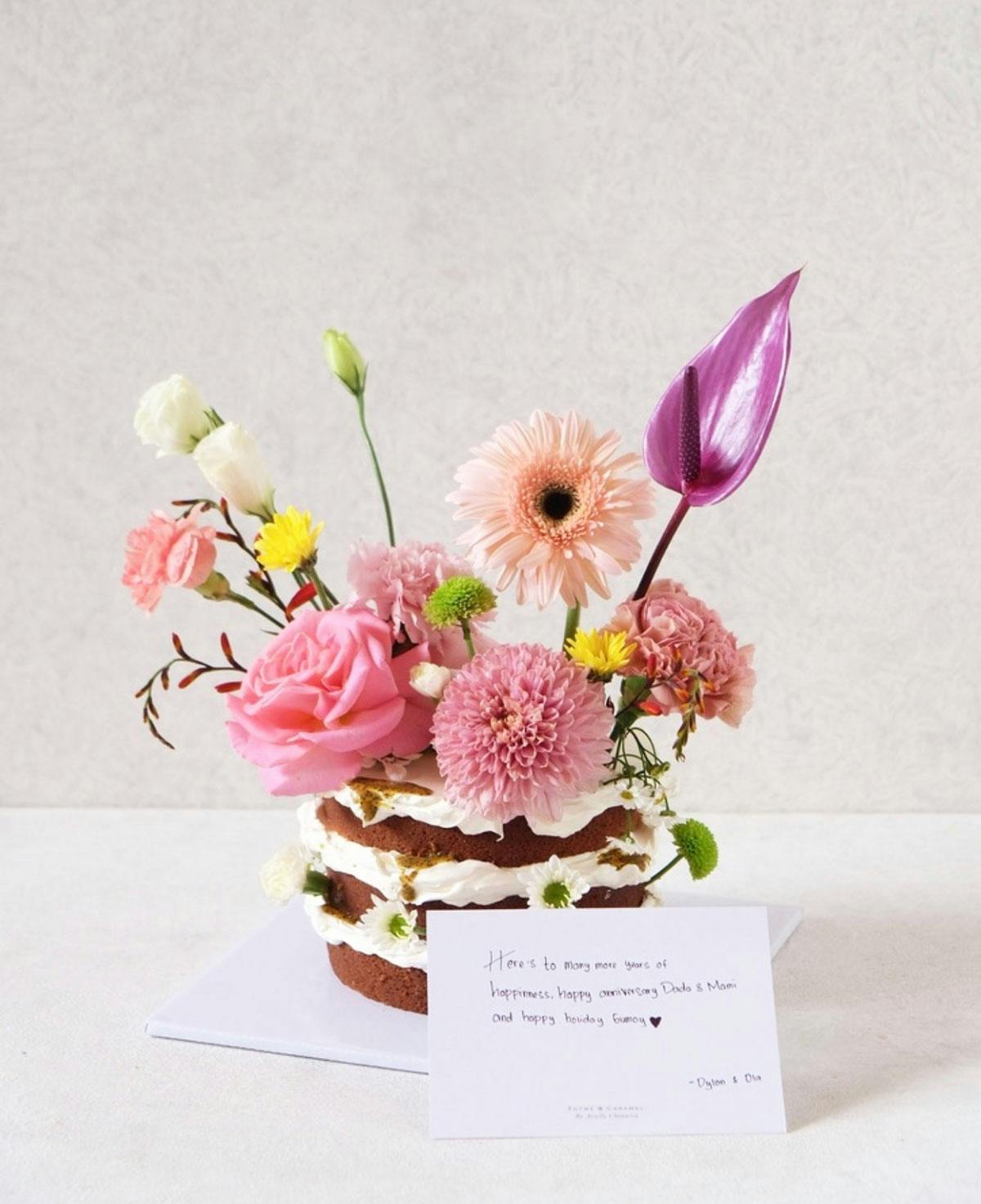 beautiful flower design celebration cake against white background