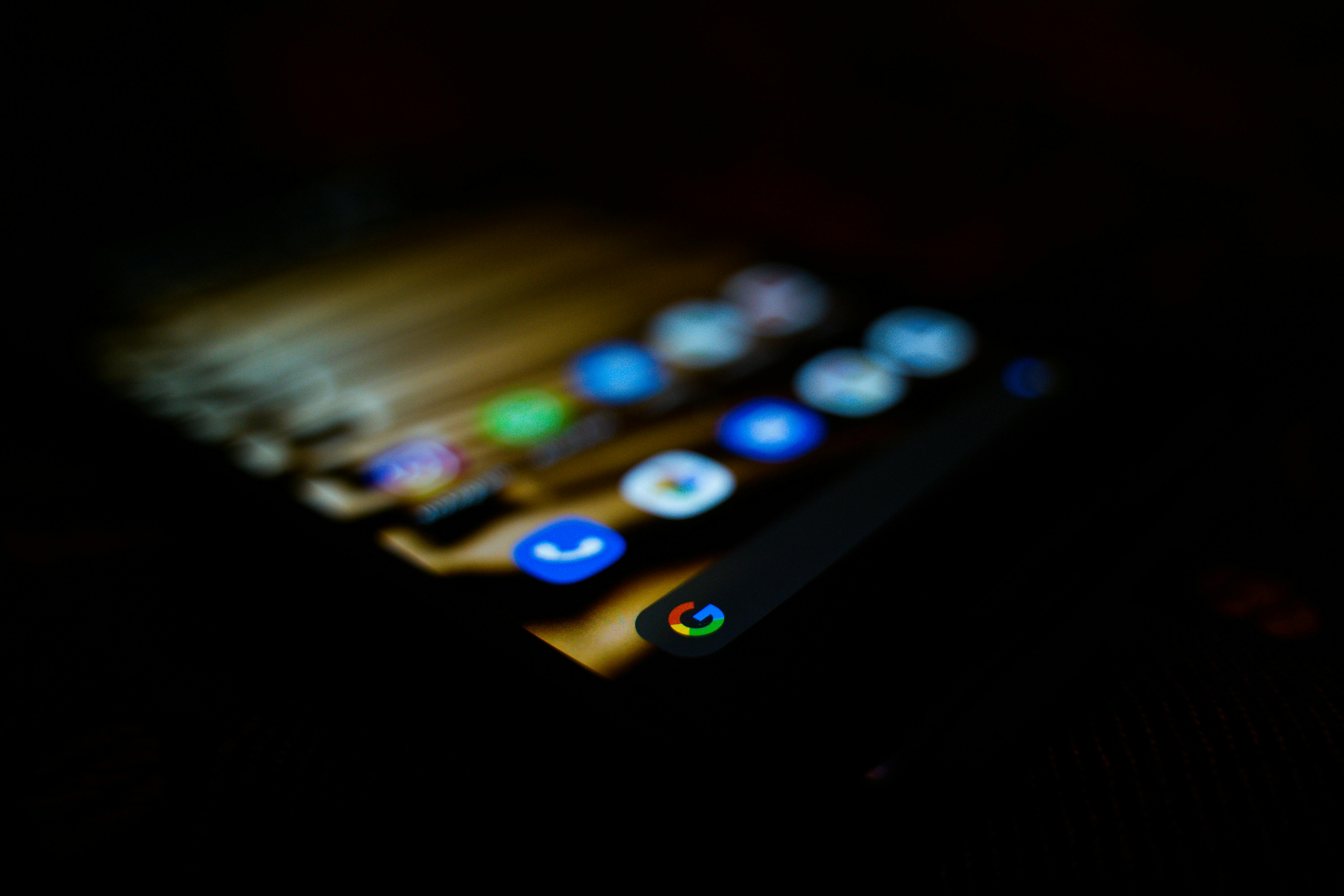 Smartphone lit up – dark background
