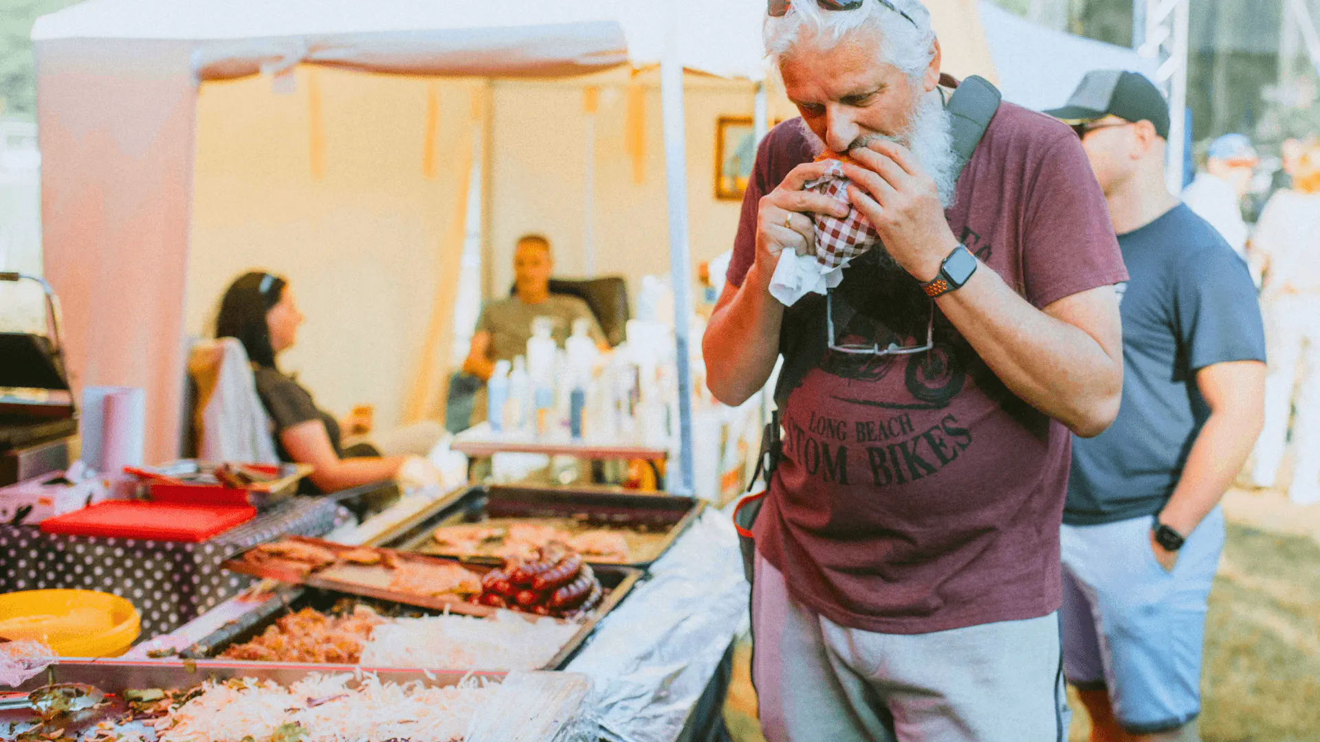 man enjoying food at food festival