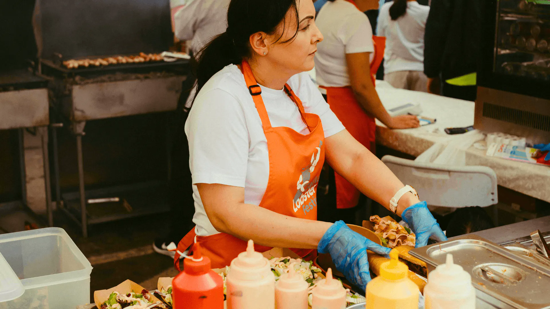 woman preparing food at a food festival