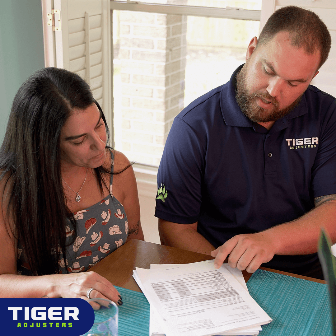 BLOG_IMAGE: Tiger Adjusters Public Adjuster meeting with a homeowner to review her insurance policy 
