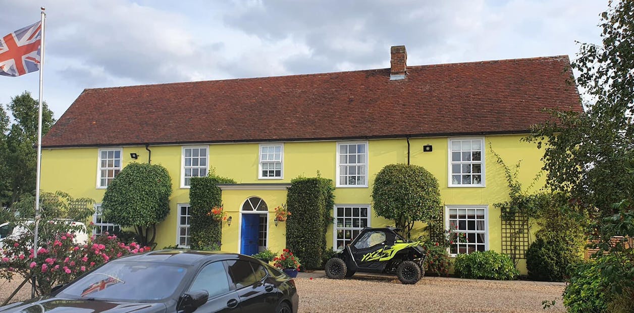wide angle before image of a large house
