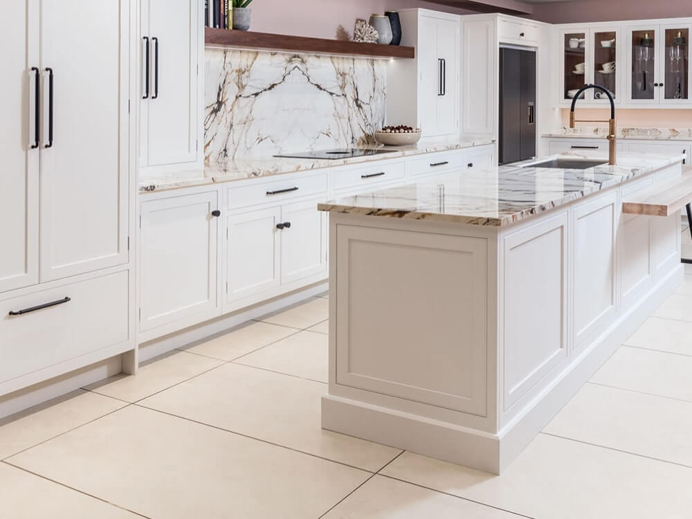 White kitchen cabinets with a marble worktop