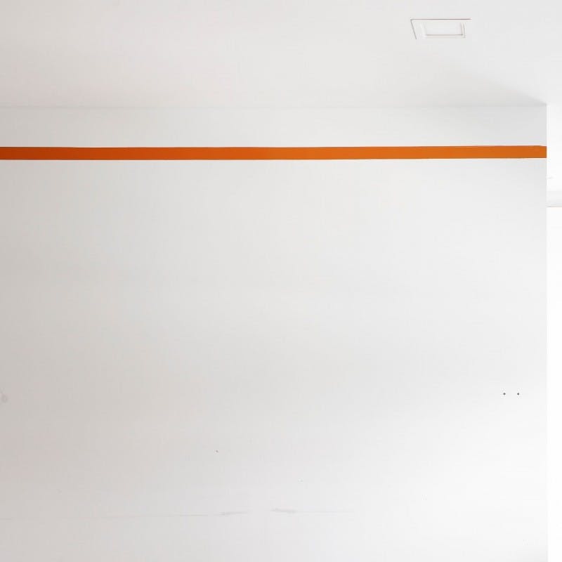 Masking White Wall with Orange Painters Tape