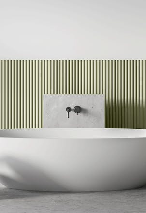Muted green half-height panelling in a bathroom