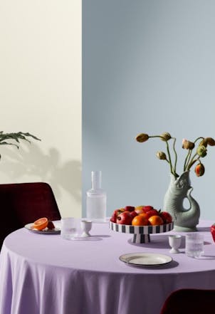 Pale blue-grey dining room wall with a cream section