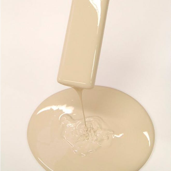 Beige Paint Dripping from Wooden Stirring Stick