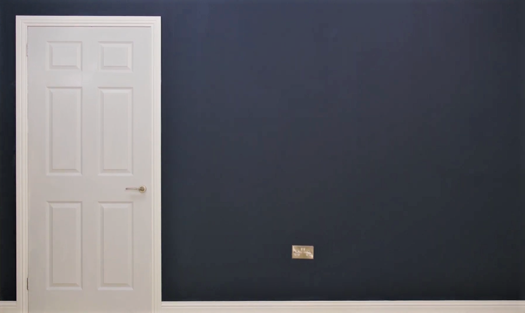 Door painted white with blue walls
