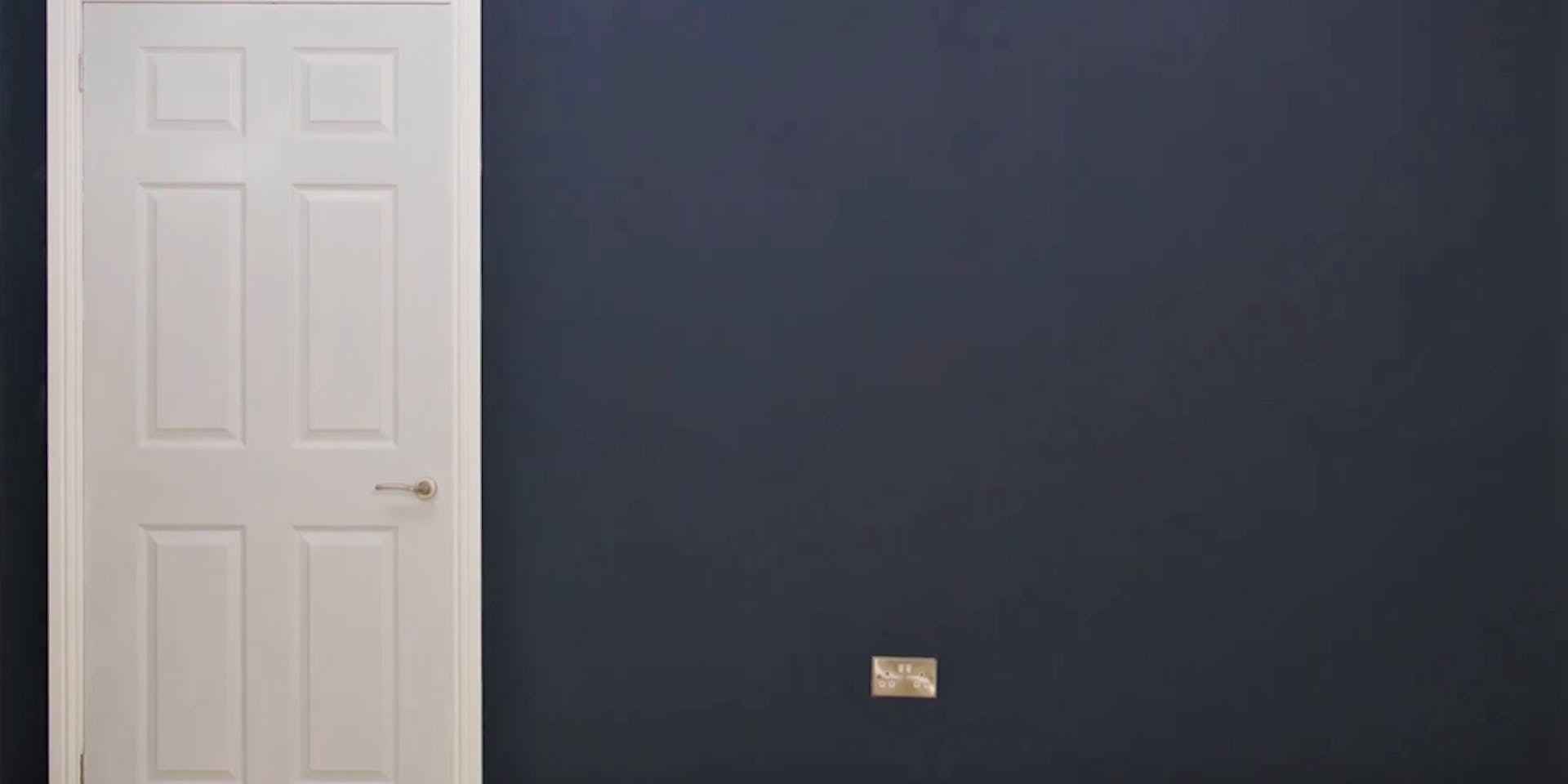 Door painted white with blue walls