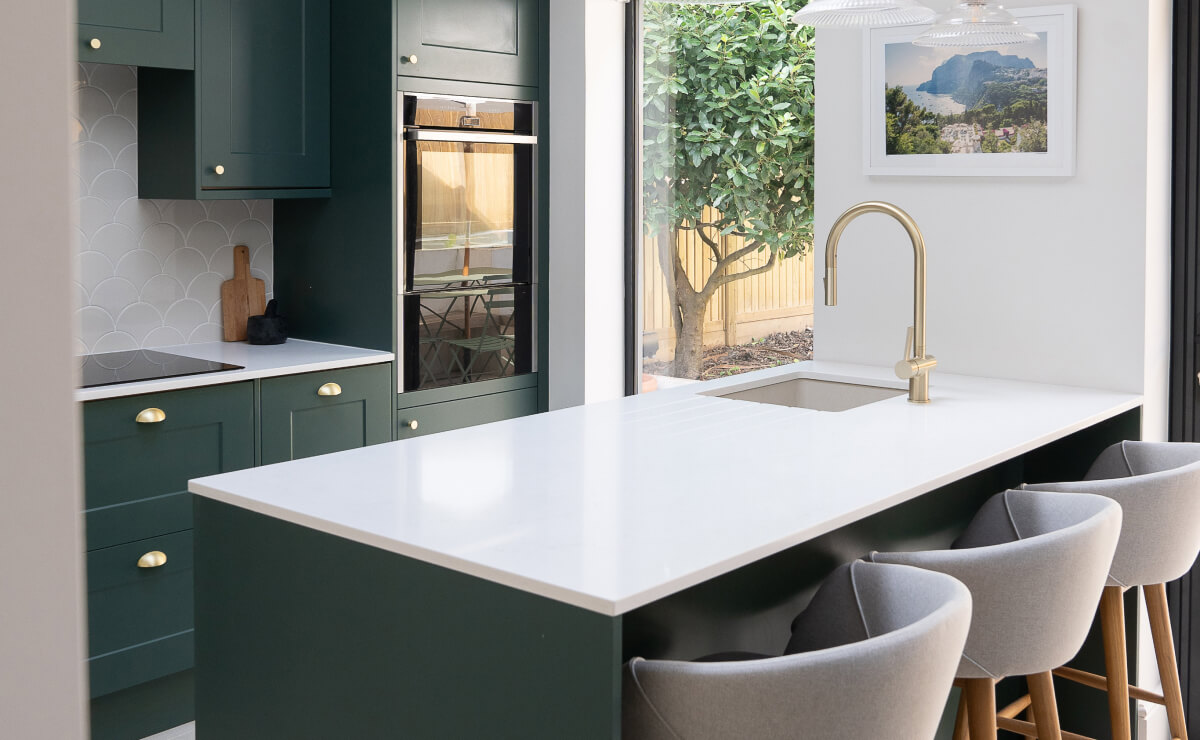 Dark green and gold kitchen