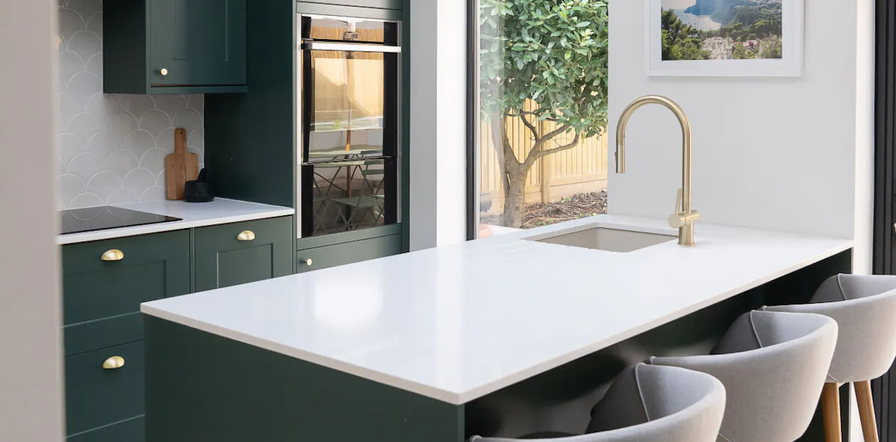 Dark green and gold kitchen