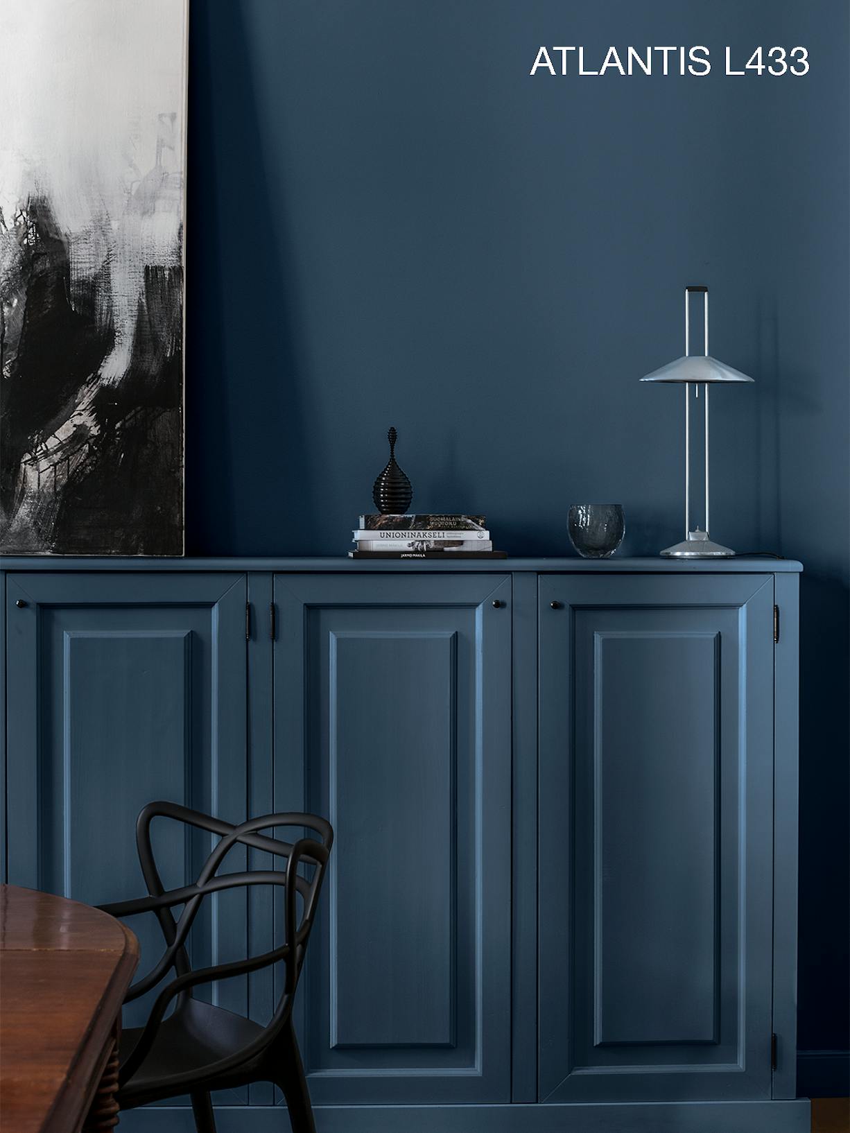 Deep Blue Cabinet Against Same Coloured Wall with Decorations
