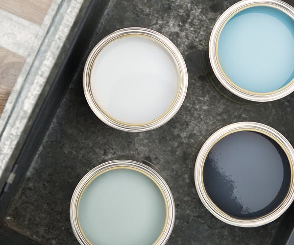 open paint tin sample pots blue colours