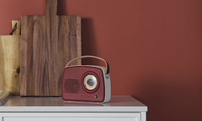 red radio against red wall painted in shade madras n411