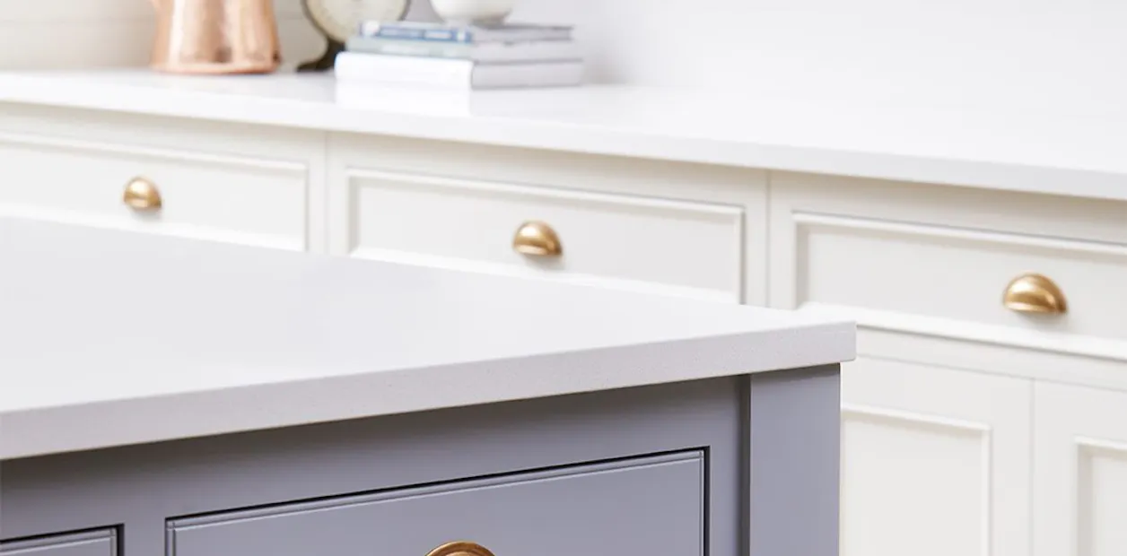 Grey kitchen island and white cabinets