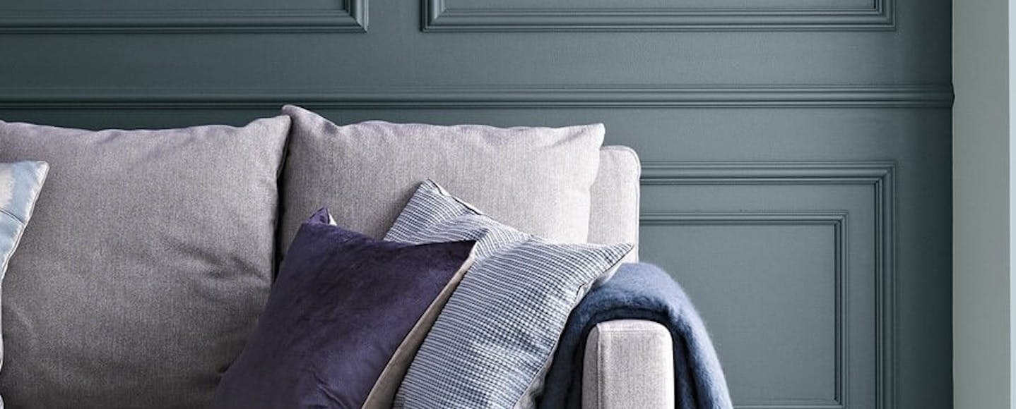 Charcoal blue wall in a living room