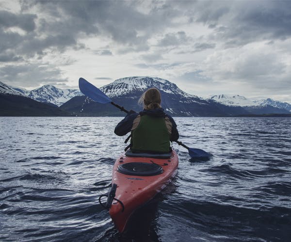 man on canoe Nordic lake