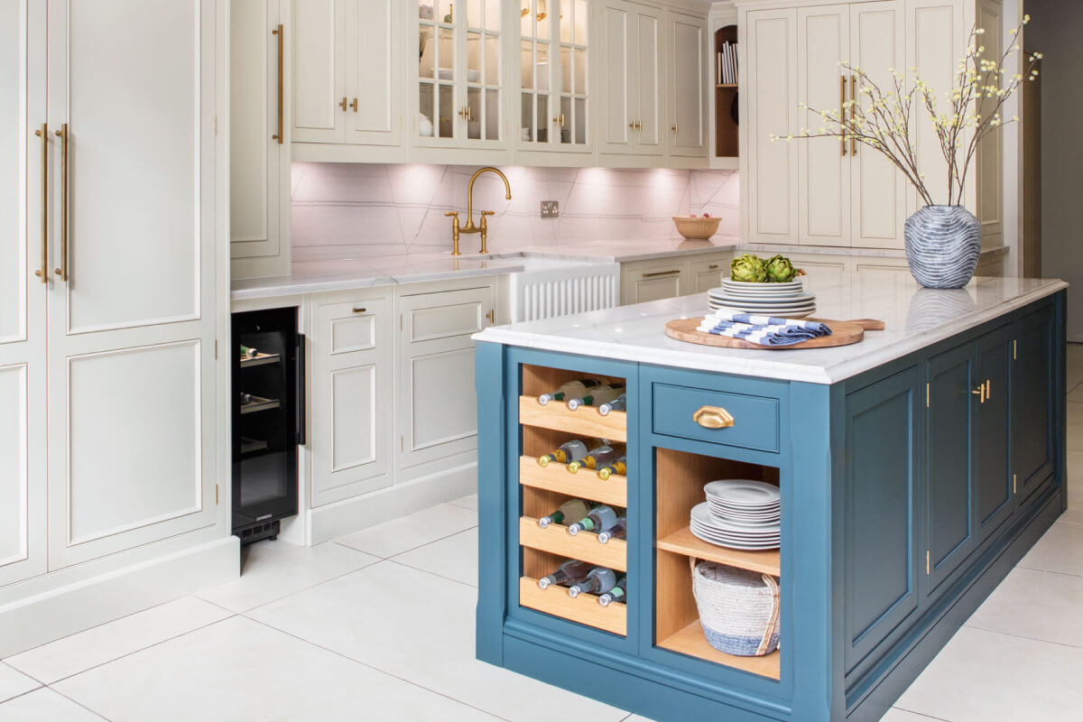 blue kitchen island in front of white kitchen cabinets