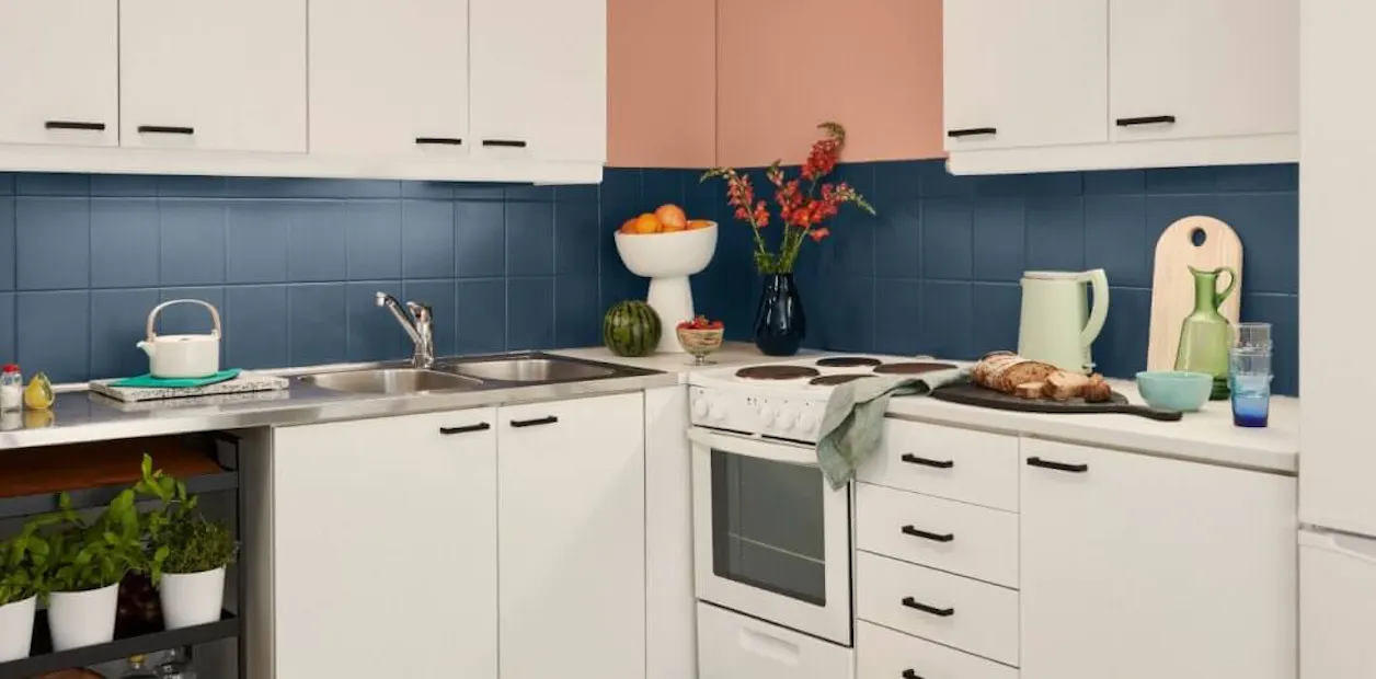 white kitchen cabinets with blue tiles