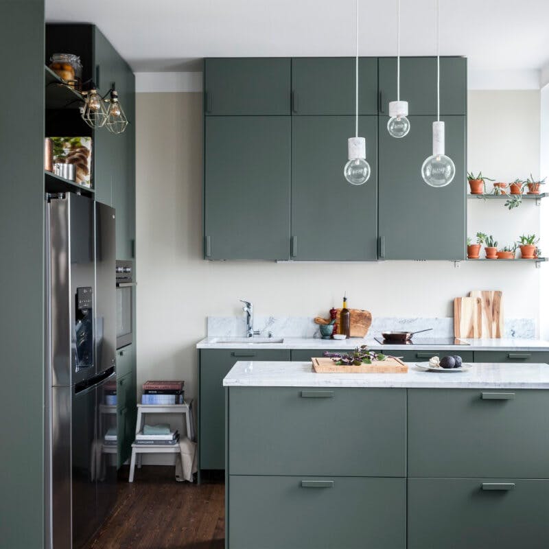 Green painted kitchen cupboards