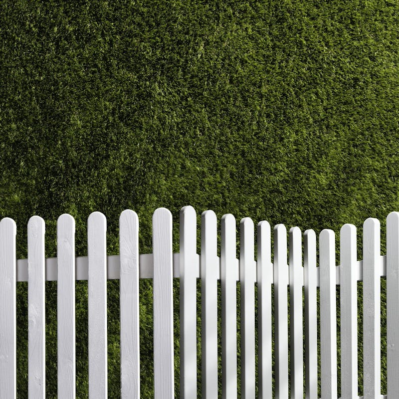 White fence on grass
