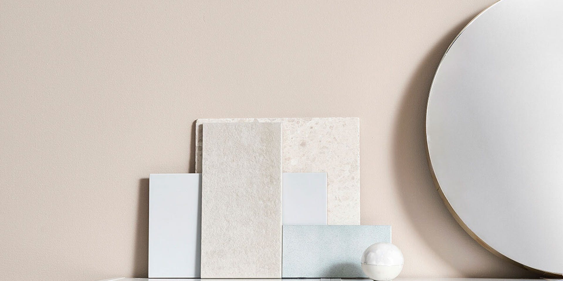 Beige Wall with Small Stone Slabs and Mirror