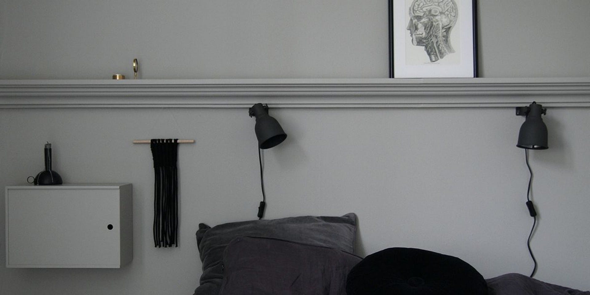 Dark Grey Bedding Against Light Grey Wall
