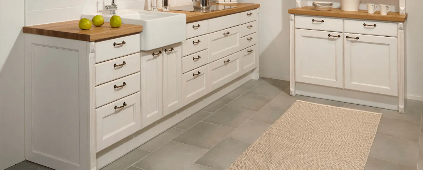 white kitchen with a wooden countertop