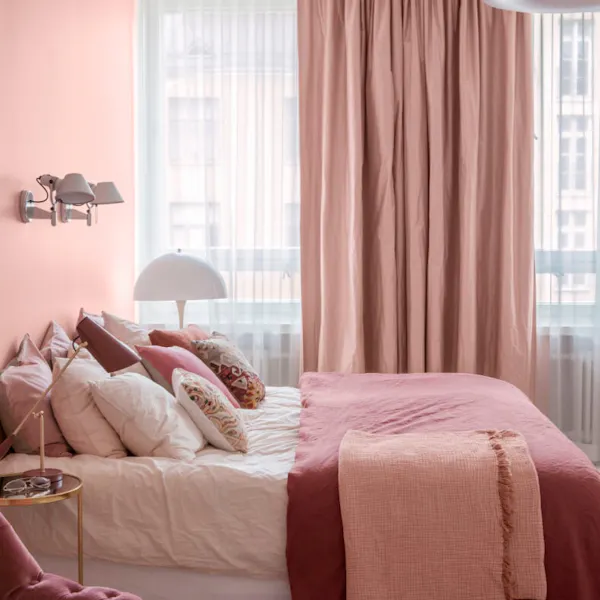 open and airy pink bedroom