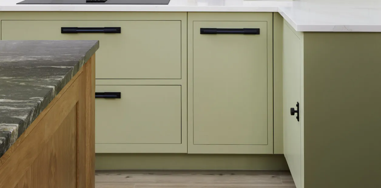 muted green kitchen cabinets