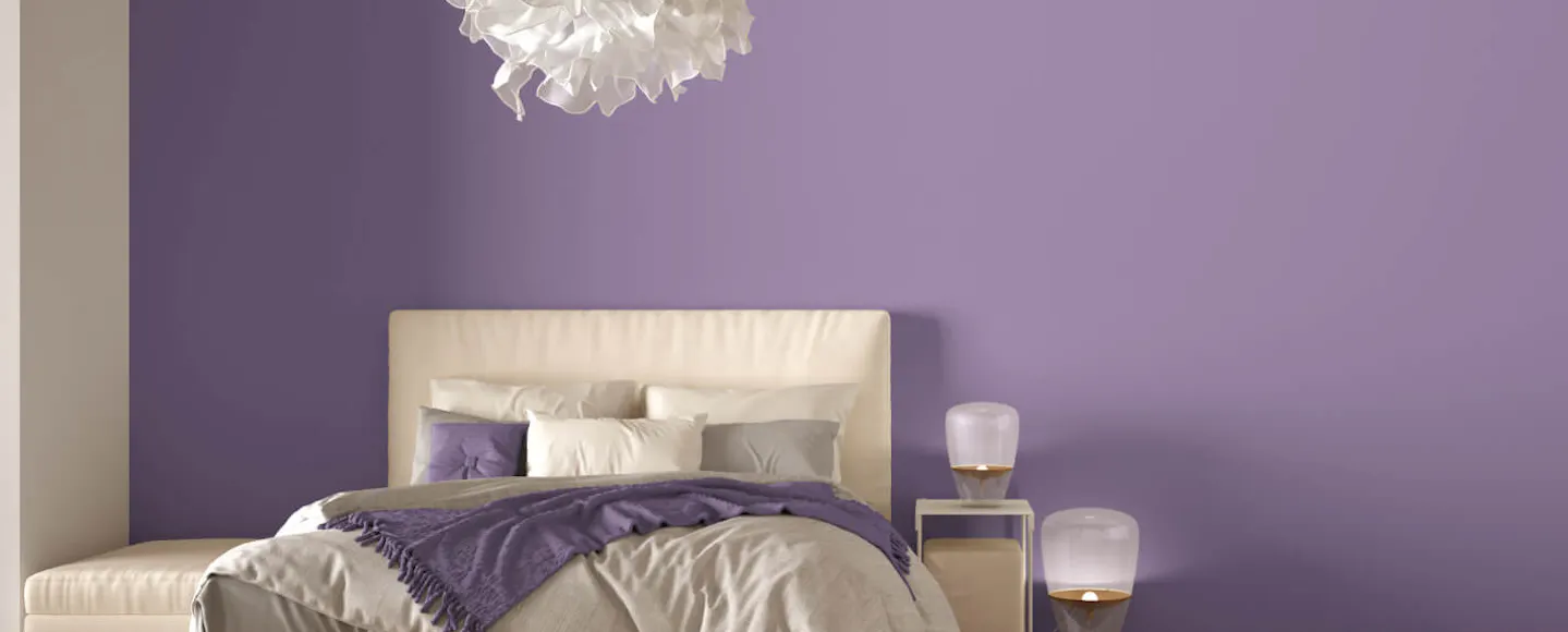 Bedroom with a bright purple wall