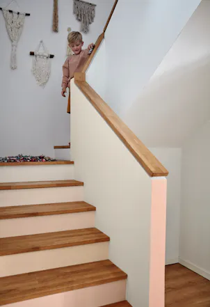 Stairwell painted with a soft beige hue