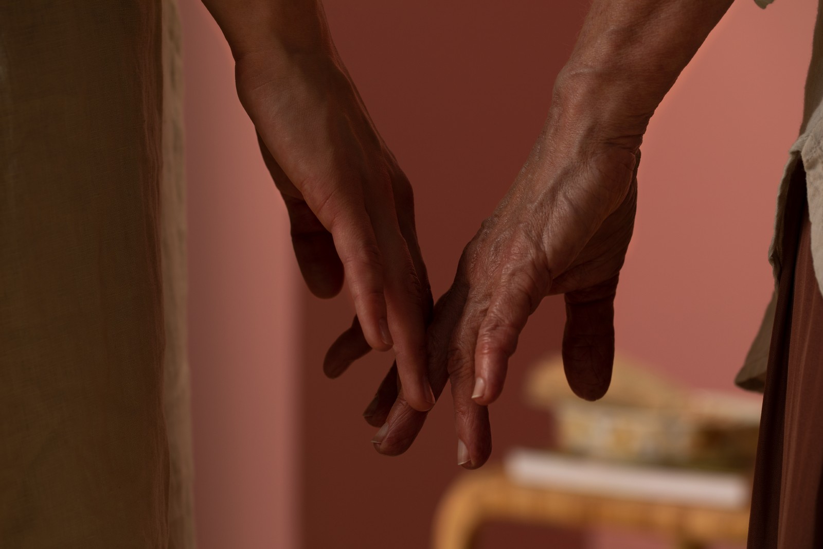 held hands pink walls hero banner