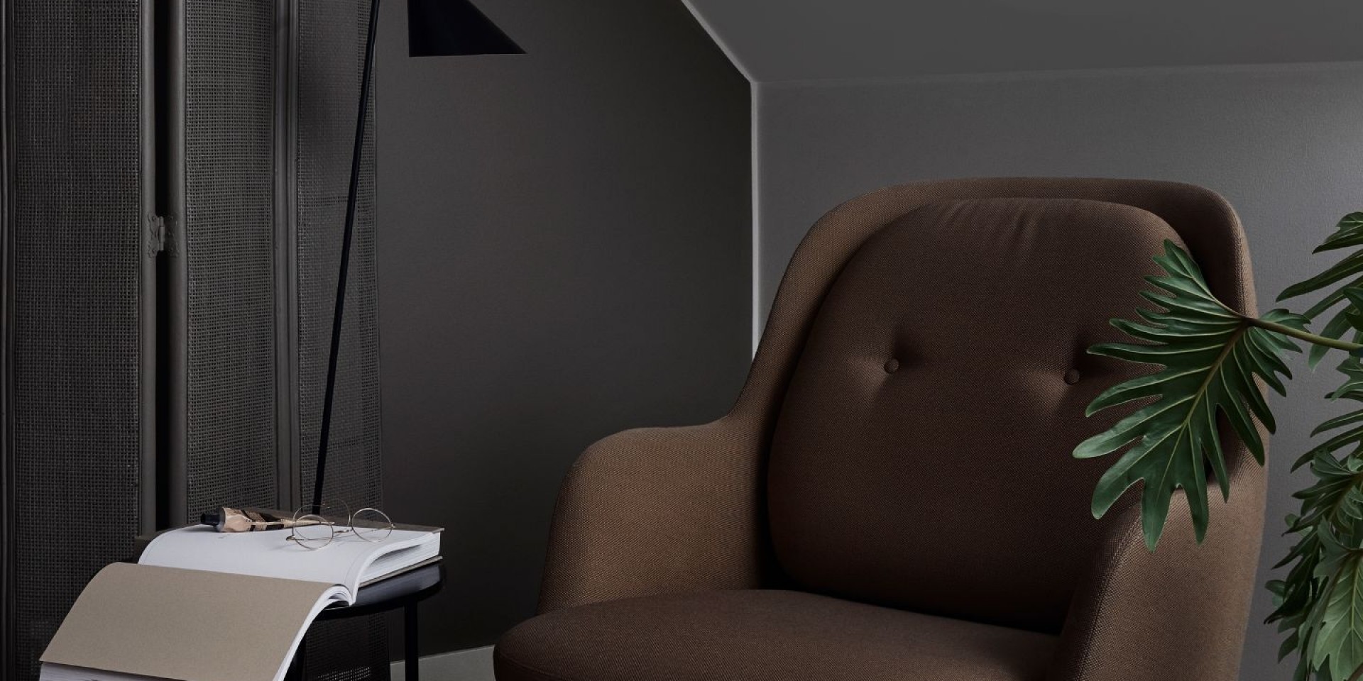 Brown Armchair Against Dark Grey Wall