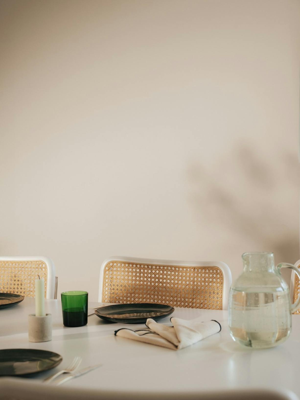 beige painted wall in dining room setting close up of table and chair