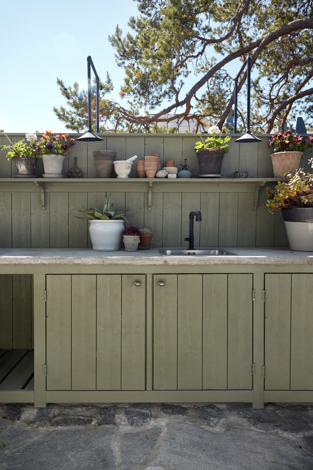 Outdoor kitchen painted in a Tikkurila wood paint.