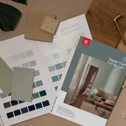 colour cards and colour chips laying on a table next to complimentary textures and accents
