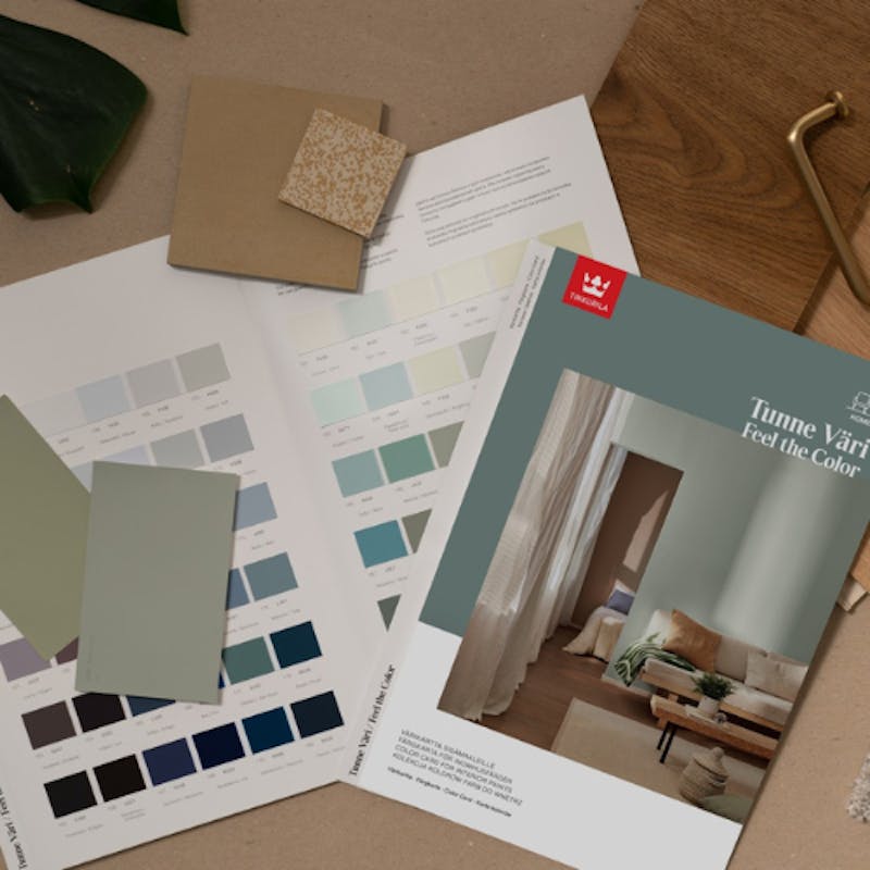 colour cards and colour chips laying on a table next to complimentary textures and accents