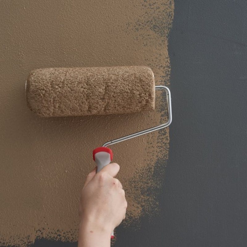 brown paint roller on wall