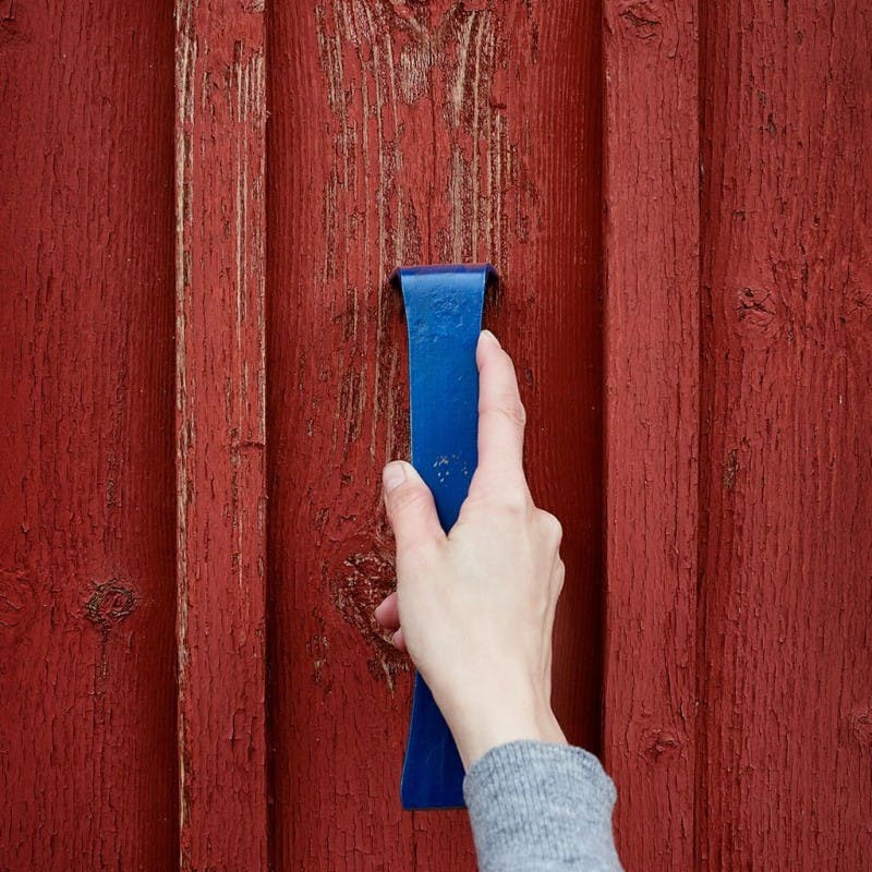 Remove loose paint from the wall