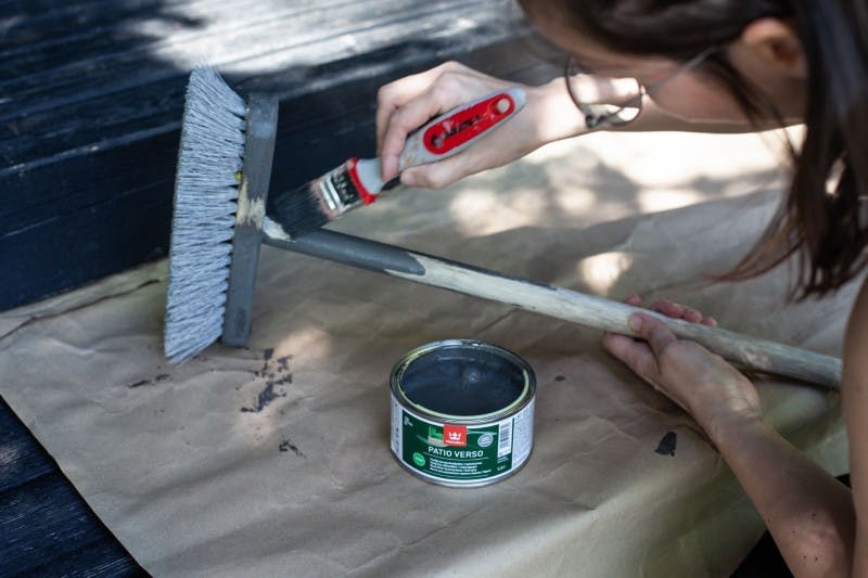 Woman Painting Sweeping Brush Grey with Tikkurila Paint