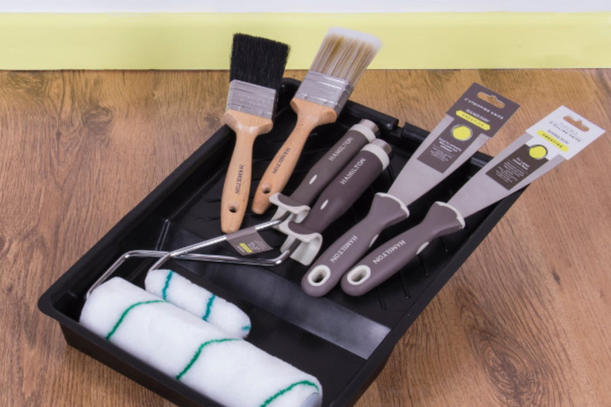 set of painting tools on black tray