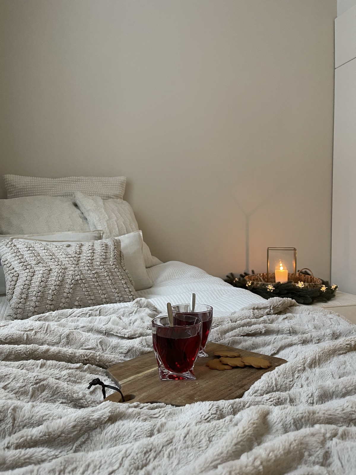 cosy bedroom setting candles and cushions