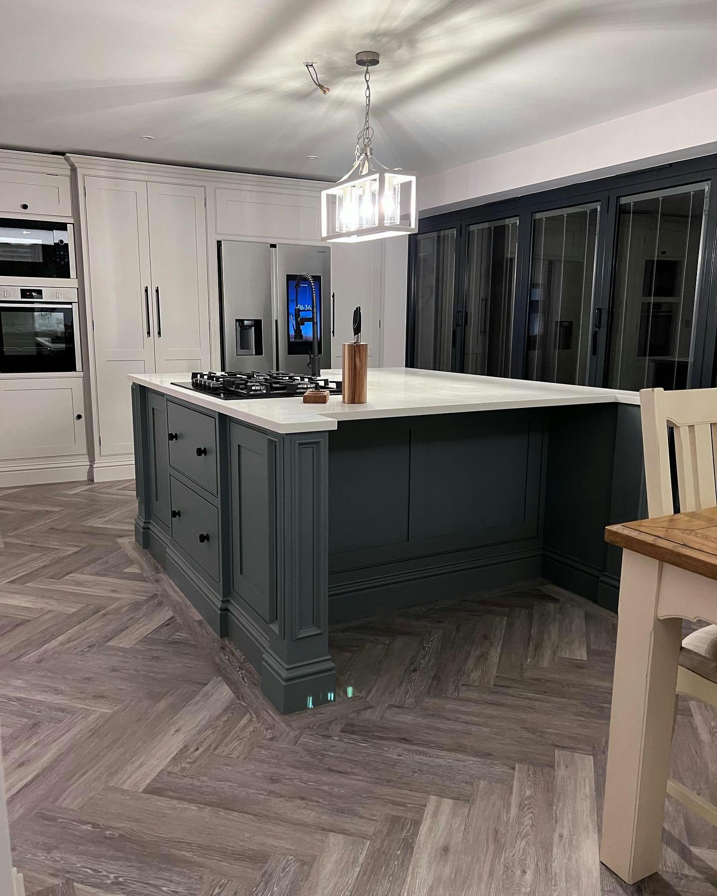 bespoke wood kitchen cabinets painted in dark blue